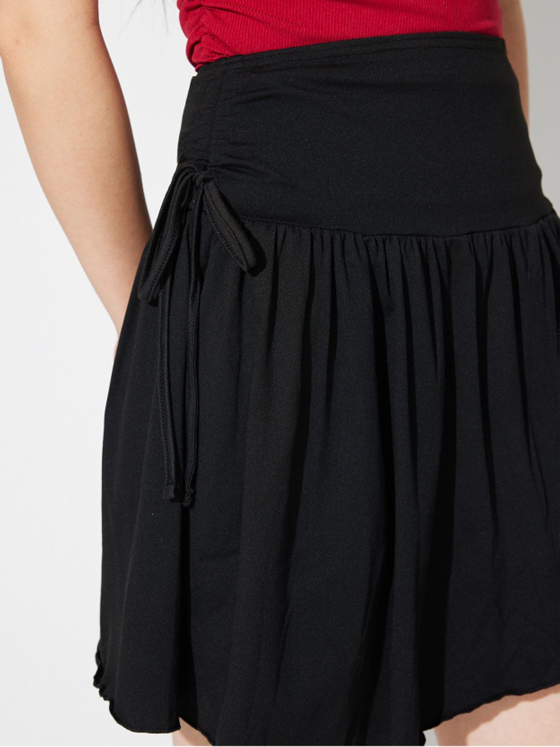 Side Tie Asymmetric Hem Mini Skirt