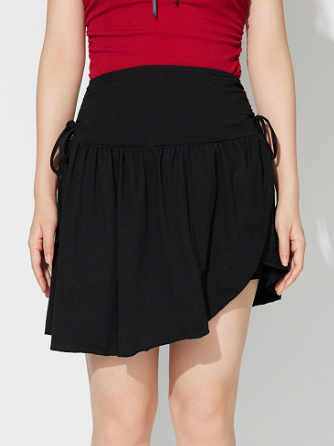 Side Tie Asymmetric Hem Mini Skirt